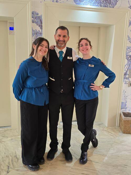Interns standing next to their supervisor, showing strong team connection during their internship program