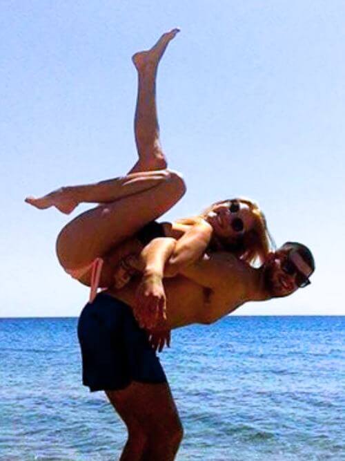 Two interns playfully having fun at the beach